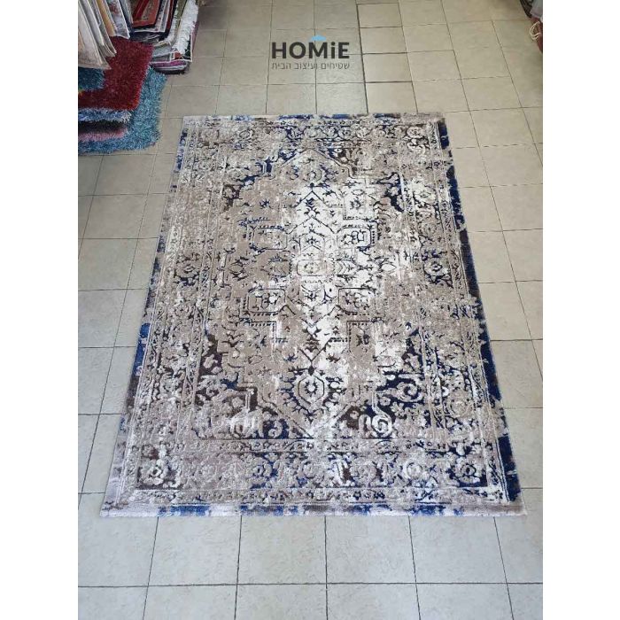 שטיח וינטג' משופשף מדליון מודרני יוקרתי דגם אלכסנדרה 22/35 בצבע חום, בז' וכחול. השטיח העשוי היטסט-ויסקוזה ישתלב בסלון, בחדר שינה, בחדר ילדים, באמבטיה, במטבח, במסדרון, בפינת אוכל, בחדר עבודה ובמשרד. 