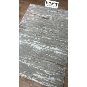 שטיח סלון אבסטרקטי מודרני דגם פלמה בצבעי אפור, שמנת וחום מונח על רצפת פרקט