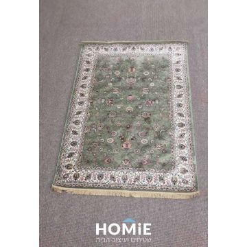 שטיח סלון לורד 859 פרוש על הרצפה במבט מלא, שטיח קלאסי פרחוני ירוק בסגנון זיגלר עם מסגרת מעוטרת ופרנזים
