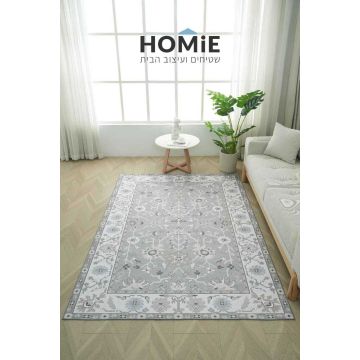 שטיח אפור דגם ניקולאוס פרוש על רצפת פרקט בסלון, עם דוגמת פרחים קלאסית ומסגרת בהירה