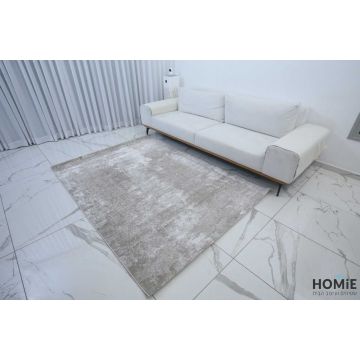 שטיח אבסטרקטי מודרני שיש אפור בז' דגם לורן 10. השטיח היוקרתי משתלב בסלון, חדר שינה, חדר ילדים ותינוקות, מסדרון, חדר משפחה ואורחים, חלל הכניסה לבית, פינת אוכל, מטבח, חדר עבודה ומשרד. 