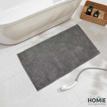 שטיח אמבטיה שניל מודרני פונפונים אפור בהיר דגם מלודי 03. השטיח היוקרתי מתאים גם לשירותים ושאר חלל הבית. הוא מגיע בקונסטלציית פונפונים מגניבה ונעימה למגע ושכבה בתחתית שמונעת החלקה. 