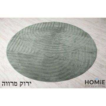 שטיח עגול דגם היילי 01 בצבע ירוק מרווה מונח בשלמותו על רצפת פרקט בהיר, עם טקסטורת קשתות תלת-ממדית