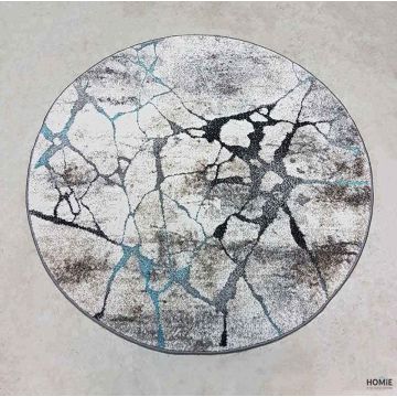 שטיח עגול אבסטרקטי מודרני דגם איביזה 73/98 בצבעי טורקיז, שחור, אפור ושמנת. השטיח מתאים לסלון ושאר חלל הבית.