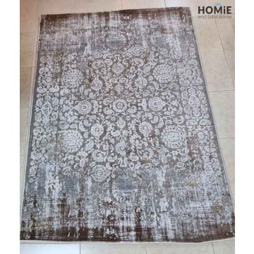 שטיח וינטג' מודרני פרחוני מדליונים מעוצב משופשף דגם קארינה 04 בצבע חום, אפור, בז' ושמנת. השטיח המרשים והיוקרתי העשוי היטסט-ויסקוזה מתאים לסלון, חדר שינה, מסדרון, חדר ילדים ותינוקות, חדר אורחים, פינת ישיבה, פינת משחקים, פינת אוכל, חדר עבודה ומשרד. 